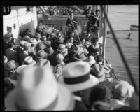 Members of the press surround Commander Richard E. Byrd as he waves goodbye, Los Angeles, 1928