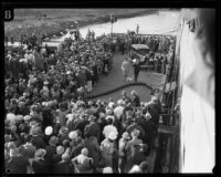 Commander Richard E. Byrd is greeted by a large crowd as he arrives at the wharf, Los Angeles, 1928