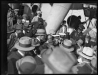 Commander Richard Byrd walks through a crowd while aboard the C. A. Larsen, Los Angeles, 1928