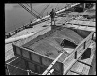 Airplane wing sits in a crate aboard the C. A. Larsen, Los Angeles, 1928
