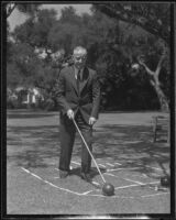 George B. Campbell, president of California Building-Loan League, playing in outdoor game, 1930s