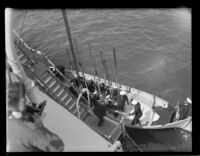 Admiral Jehu V. Chase boarding a whaleboat, Los Angeles Harbor, 1931