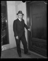 Raymond L. Chesebro, city attorney, at the entrance to the Grand Jury, Los Angeles, 1930-1939