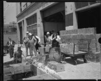 U. S. Marshal Robert E. Clark and others at an apparent warehouse raid, Los Angeles, 1933-1939