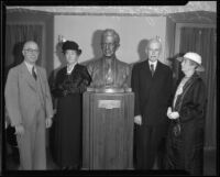 Dr. William A. Bryan, Julia Bracken Wendt, John S. McGroarty, and Mrs. A. S. C. Forbes pose with the bust of McGroarty, Los Angeles, 1934