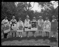 Otis Art Institute students holding posters that they created for the California Botanic Garden, Los Angeles, 1928