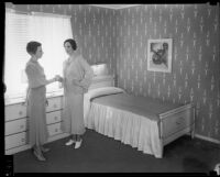 Lillian Gifford shows bedroom in Times Model Home, Los Angeles, 1935