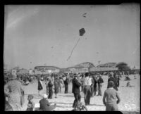 Children fly kites near Silver Spray Pleasure Pier, Long Beach, [between 1920-1939]