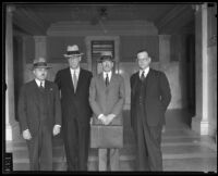 Judge Gavin W. Craig with three others in a courthouse, Los Angeles, 1930s