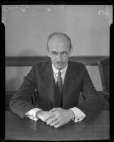 Judge Gavin W. Craig seated at a desk, Los Angeles, 1928