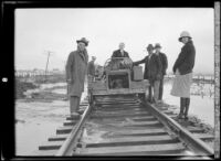 People travelling by handcar in a flooded landscape after the failure of the St. Francis Dam, Santa Clara River Valley (Calif.), 1928