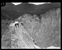 Side view of the remaining center portion of the St. Francis Dam after its disastrous collapse, San Francisquito Canyon (Calif.), 1928