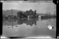 Flooded area with homes surrounded by water following the failure of the Saint Francis Dam, Santa Paula (Calif.), 1928
