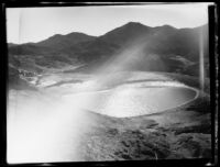 Pool of water remaining in the reservoir (?) following the failure of the Saint Francis Dam, San Francisquito Canyon (Calif.), 1928
