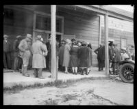 Throngs seeking to identify victims in a temporary morgue after the failure of the Saint Francis Dam and resulting flood, Newhall (Calif.), 1928
