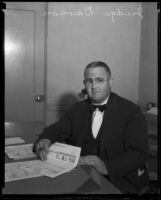 Judge Leroy Dawson signing documents, Los Angeles, 1935