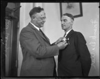 Frank Dewar recieves undersheriff badge from Sheriff Traeger, Los Angeles, 1930