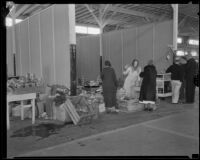 Grocery store in temporary quarters in the Oil Equipment and Engineering Exposition hall after the Long Beach earthquake, Compton, 1933