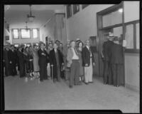 Residents seeking building permits after the earthquake stand in line at the municipal building, Long Beach, 1933