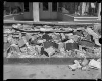 Rubble on a commercial street after the Long Beach earthquake, Southern California, 1933