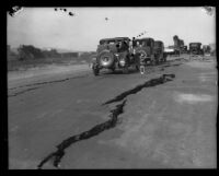 Automobiles on a road with wide cracks after the Long Beach earthquake, Southern California, 1933