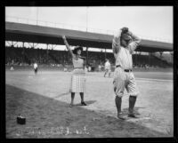 Frank Eddington and woman at Washington Park baseball field, Los Angeles, 1920-1939