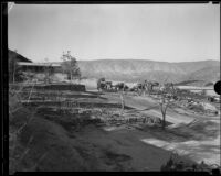 Onlookers observe National Forest Inn ruins following fire, California, 1932