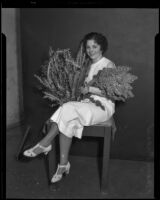 Mary Fiesel poses with wildflowers for the Los Angeles Times, Los Angeles, (1930-1935?)