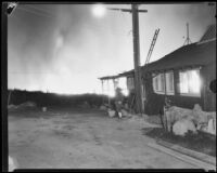 Men outside of a house during La Crescenta fires, Los Angeles, 1933