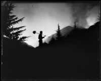 Worker silhouette during La Crescenta fires, Los Angeles, 1933