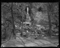 Man stands at ruins of home destroyed by the Sunset Canyon fire, Los Angeles, 1927