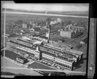 Copy negative of an aerial photograph of the proposed Firestone factory, Los Angeles, 1927