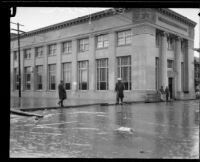 Stilt-walker on rainstorm-flooded street, Compton, 1927