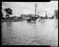 Rain-flooded street, Compton, [1927?]
