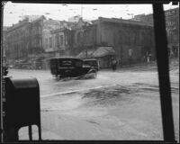Flooded intersection of 1st St. & Broadway during a rainstorm, Los Angeles, [1926?]
