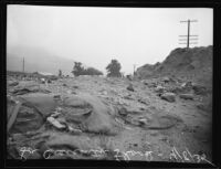 Flood debris on road after heavy reinfall, la Crescenta-Montrose, 1935