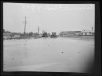 Wet roadway with houses in the distance, La Crescenta-Montrose, 1935