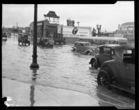 Storm-flooded Beverly Blvd. at the intersection with Lake St., Los Angeles, circa 1927-1939