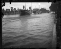 Storm-flooded intersection of 47th and Figueroa, Los Angeles, [circa 1927-1939]