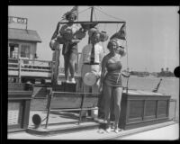 Pat Rollins, Commodore J. A. Beek, and Bubbles Hayes on a docked boat before the Tournament of Lights Festival, Newport Beach, 1935