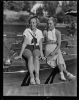 Eleanor Johansing and Mickey McComas sitting on a boat, Lake Arrowhead, 1935