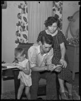 James Bailes, excluded from voting registration on the basis of illiteracy, with wife and child, 1935