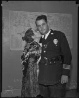 Mary Lancaster kisses Captain Bert Lytell of the Police Department the day she announces her engagement to Michael Morales, Los Angeles, 1935