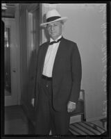 Former Texas Governor Pat M. Neff photographed in a hotel room, (San Diego?), 1935