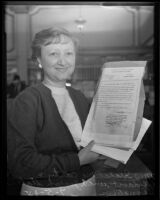 Isabel McCarty holds an affidavit bearing Joseph Stalin's signature, Los Angeles, 1935