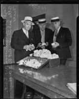 Officers of the Los Angeles Narcotics Squad pose with $35,000 worth of gum opium, Los Angeles, 1935