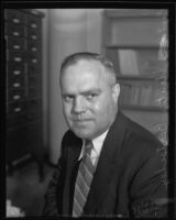 Captain Stanton L. Bertschey seated in his office, Los Angeles, 1935