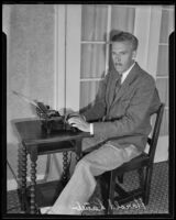 Harold Lamb, author, seated at his typewriter, Los Angeles, 1935