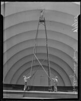 Martin Sipma painting the shell of the Hollywood Bowl, Los Angeles, 1935