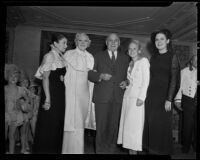 Governor Frank Merriam poses with models Emerald Hale, Maxine Jelmeland, Esther Muir, and Sarah Ross, Los Angeles, 1935